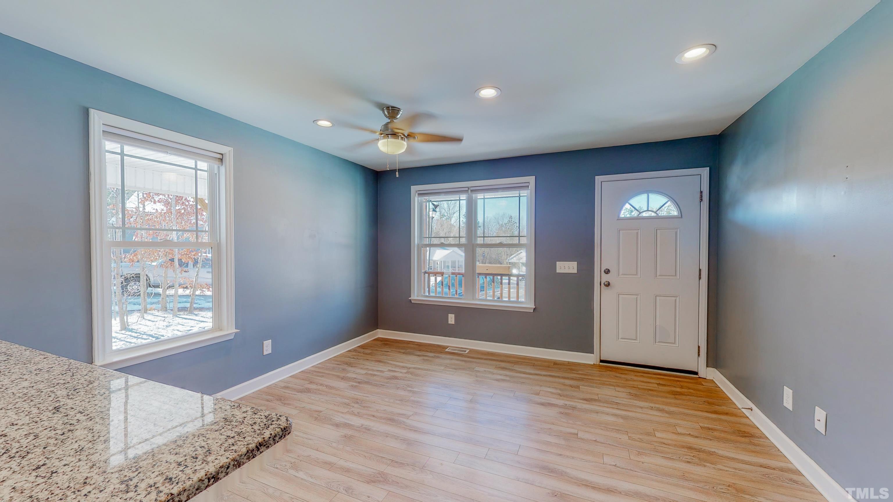 45 Eli Court Roxboro, NC 27573 - Photo 30 of 36 a view of an empty room with window and wooden floor
