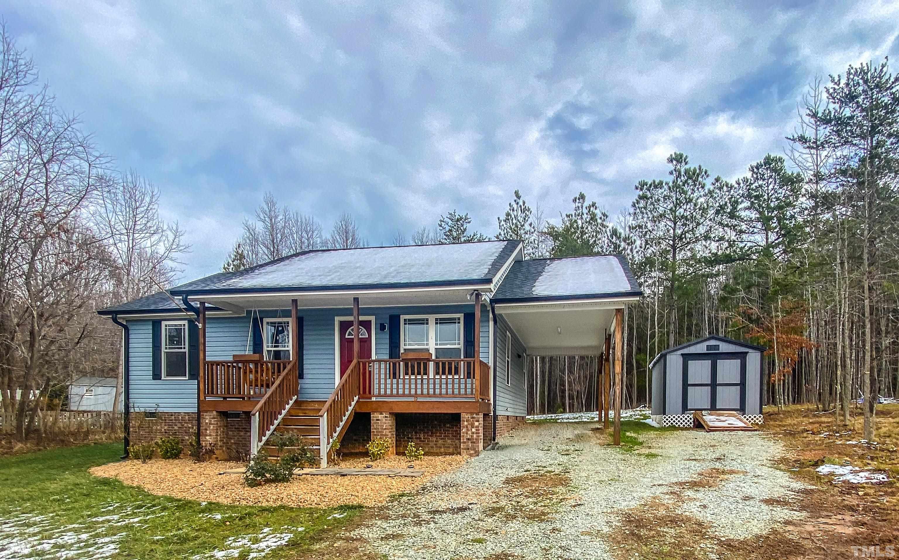 45 Eli Court Roxboro, NC 27573 - Photo 36 of 36 a front view of a house with garden