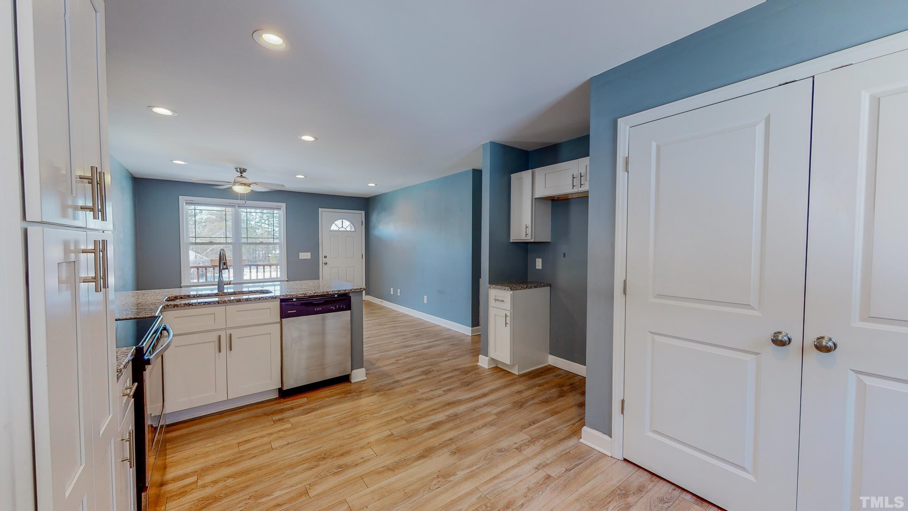 45 Eli Court Roxboro, NC 27573 - Photo 8 of 36 a kitchen with a refrigerator and a sink
