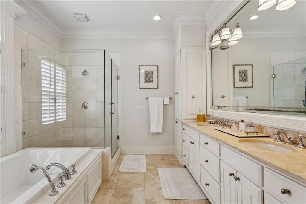 3005 Ranch Road Southeast Atlanta, GA 30339 - Photo 38 of 57 a spacious bathroom with a granite countertop tub sink and mirror
