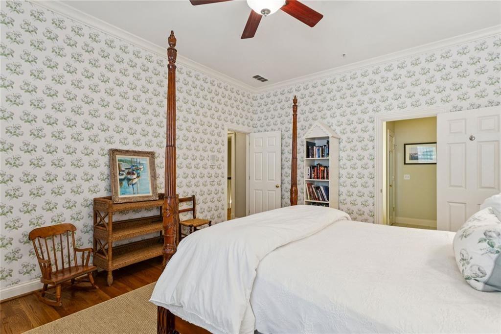 3005 Ranch Road Southeast Atlanta, GA 30339 - Photo 45 of 57 a bedroom with a bed and a chair with the bookshelf