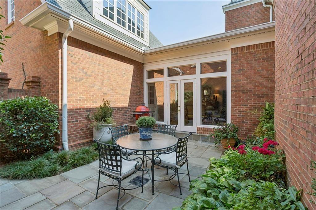 3005 Ranch Road Southeast Atlanta, GA 30339 - Photo 53 of 57 a view of a patio with a table and chairs and potted plants