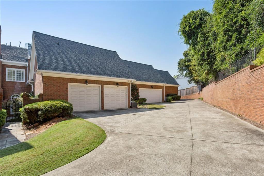 3005 Ranch Road Southeast Atlanta, GA 30339 - Photo 57 of 57 a front view of a house with a yard and garage