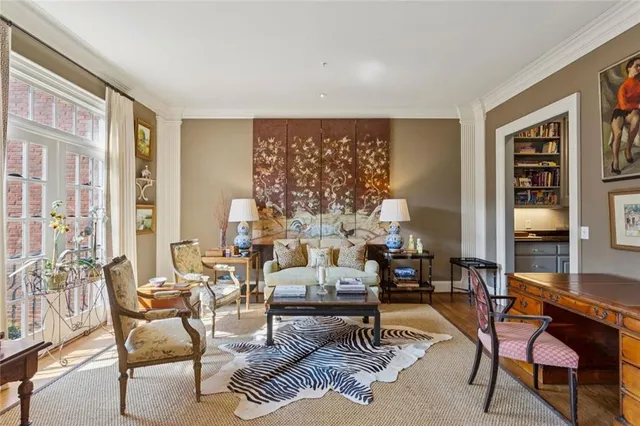 a living room with furniture and a dining table