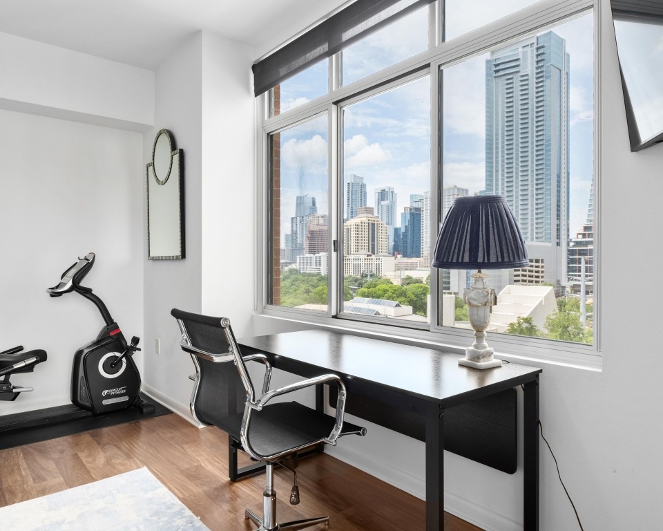 54 Rainey Street, Unit 1018 Austin, TX 78701 - Photo 11 of 33 a workspace with furniture and window