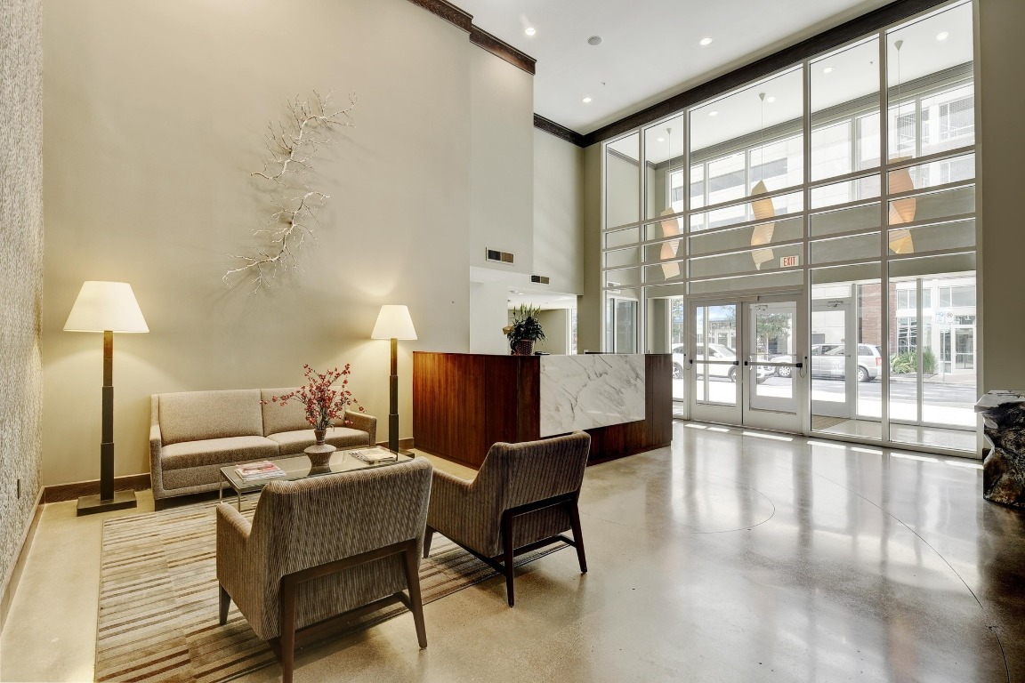 54 Rainey Street, Unit 1018 Austin, TX 78701 - Photo 25 of 33 a living room with furniture and a large window