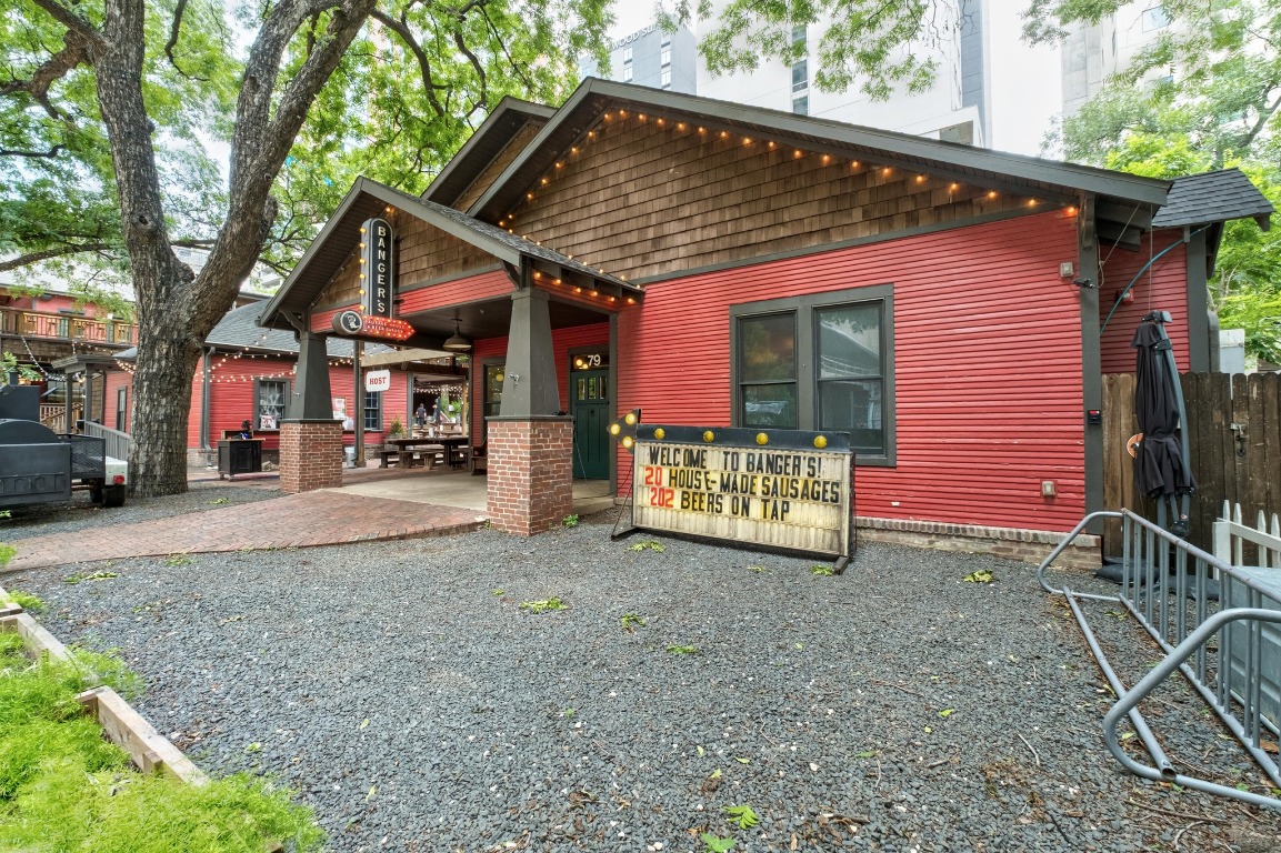 54 Rainey Street, Unit 1018 Austin, TX 78701 - Photo 29 of 33 a view of a house with a yard and street