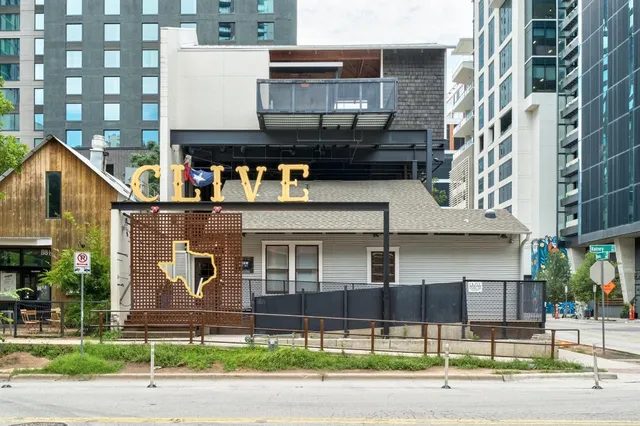 a view of a brick building with many windows