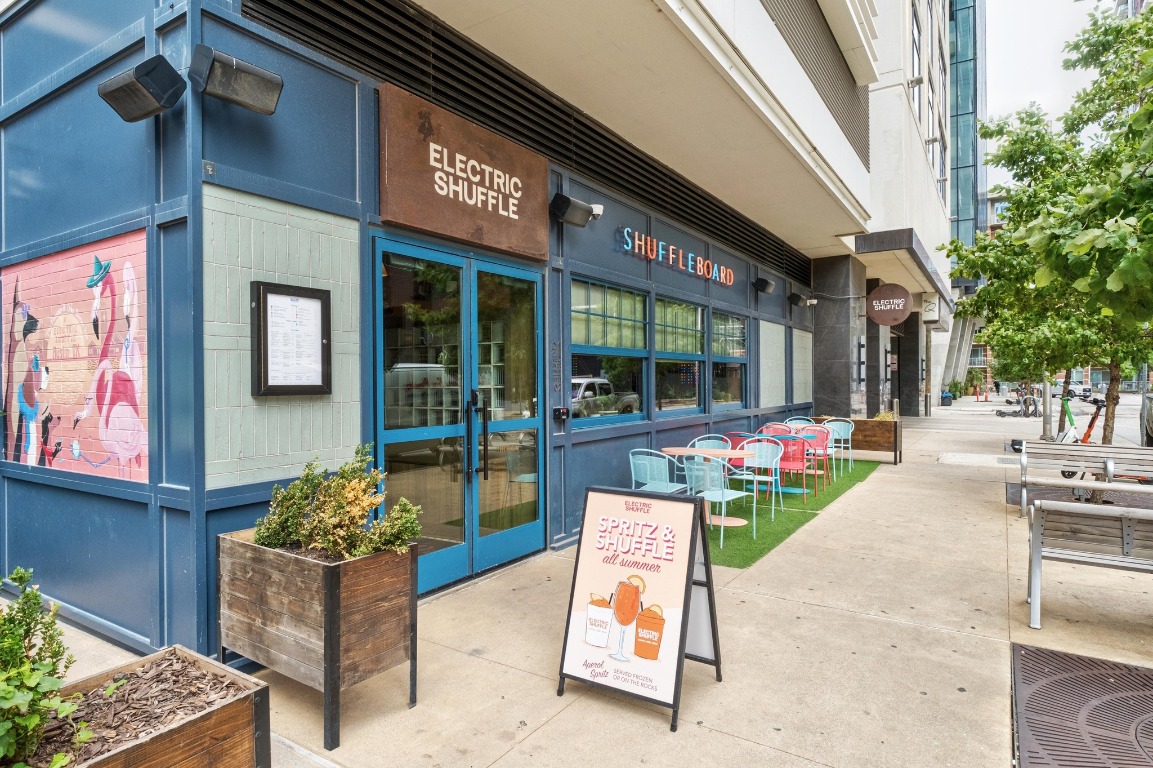 54 Rainey Street, Unit 1018 Austin, TX 78701 - Photo 31 of 33 a building outdoor space with patio furniture and potted plants