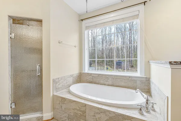 a white bath tub sitting in a bathroom