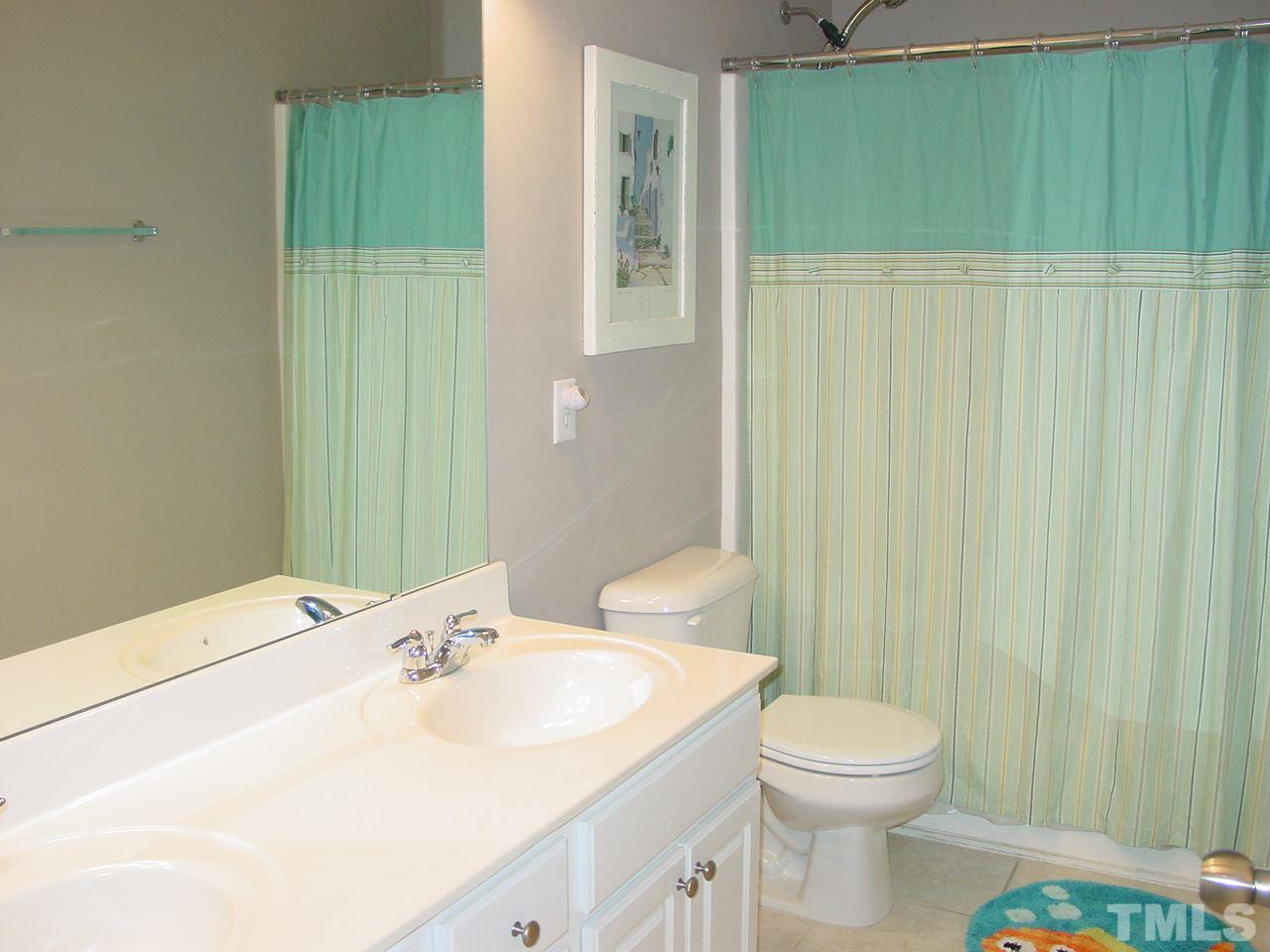 7724 Jackson Dane Drive Raleigh, NC 27613 - Photo 18 of 25 Dual sinks, tile floor