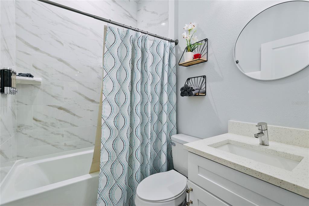 189 Statler Street Port Charlotte, FL 33954 - Photo 19 of 32 a bathroom with a white sink and a bathtub