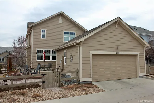 a front view of house with garage