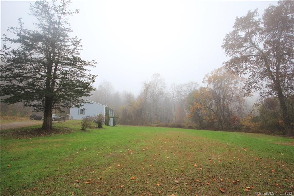90 Cook Road Prospect, CT 06712 - Photo 1 of 1 a backyard of a house with lots of green space