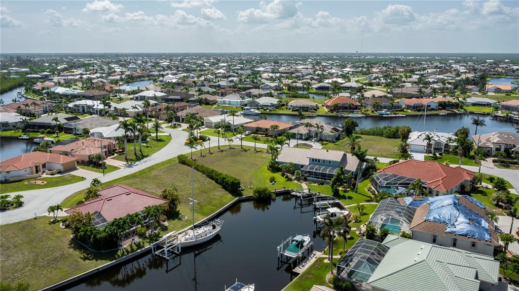 1423 Grebe Court Punta Gorda, FL 33950 - Photo 7 of 7 an aerial view of lake residential houses with outdoor space and swimming pool