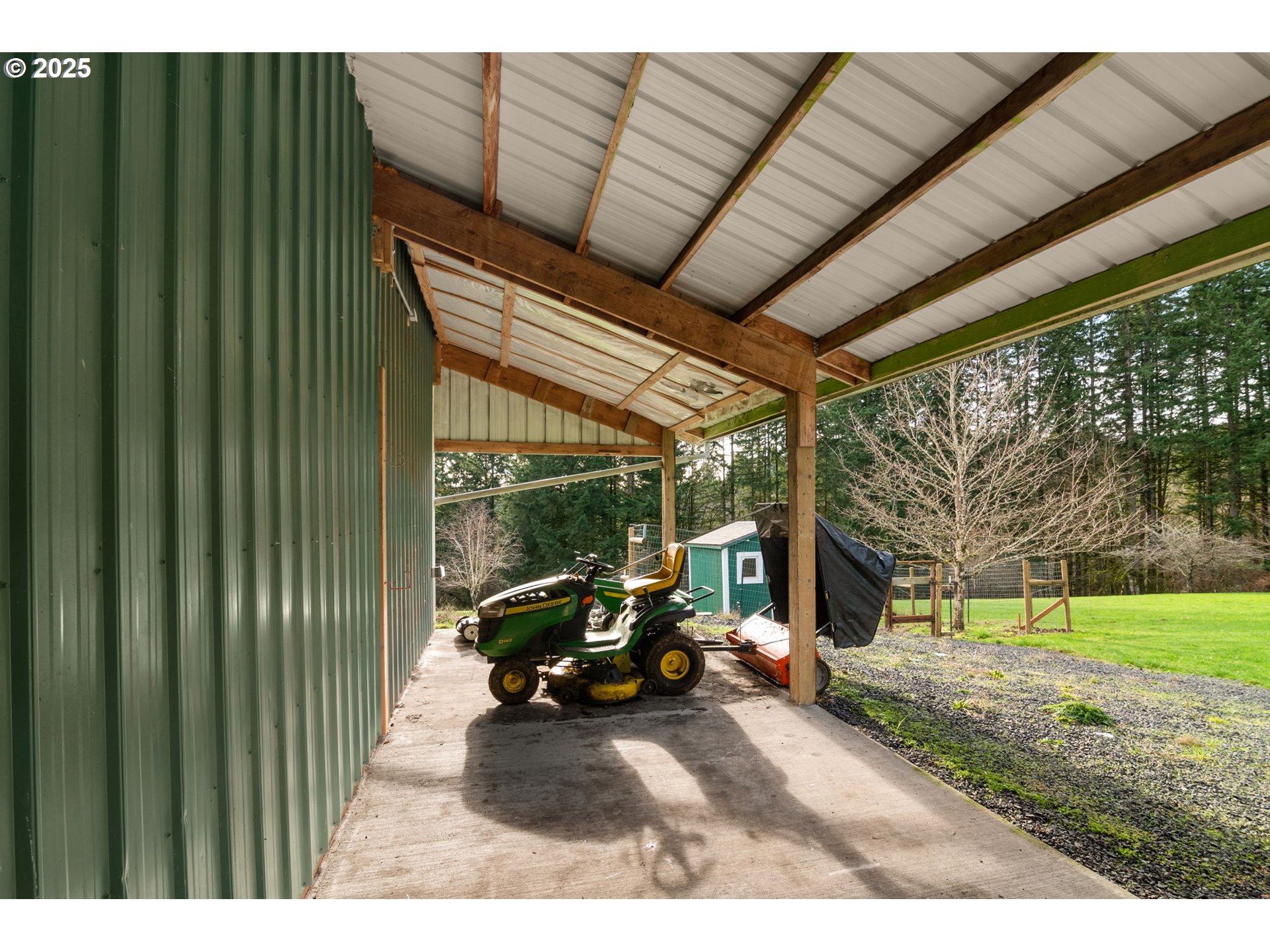 32198 Cater Road Warren, OR 97053 - Photo 17 of 48 a view of a patio with table and chairs next to a yard