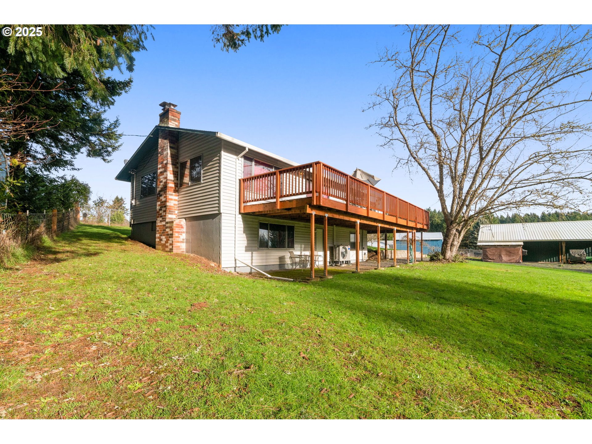 32198 Cater Road Warren, OR 97053 - Photo 24 of 48 a view of a big house with a big yard and large trees