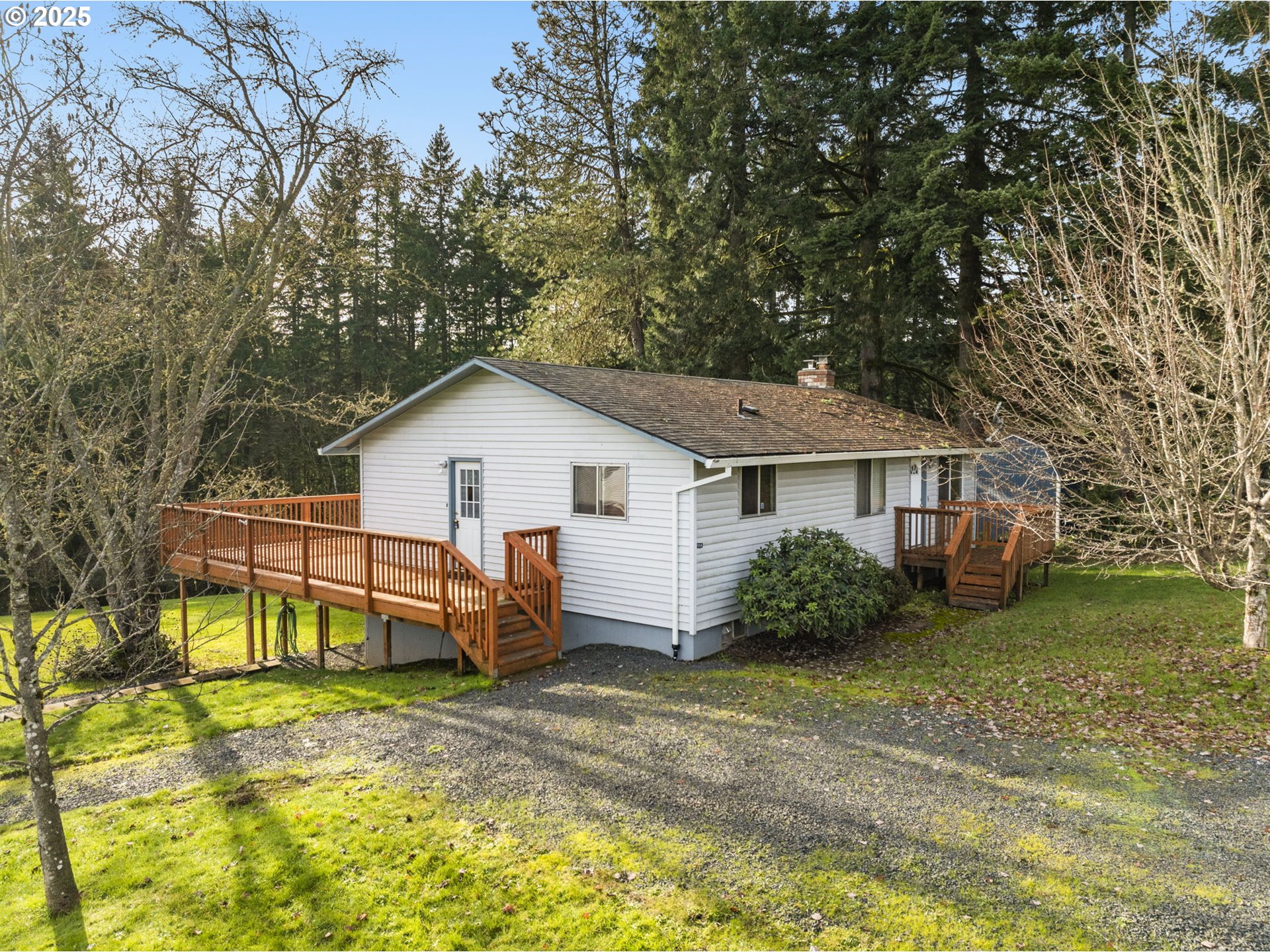 32198 Cater Road Warren, OR 97053 - Photo 25 of 48 a view of a house with a yard