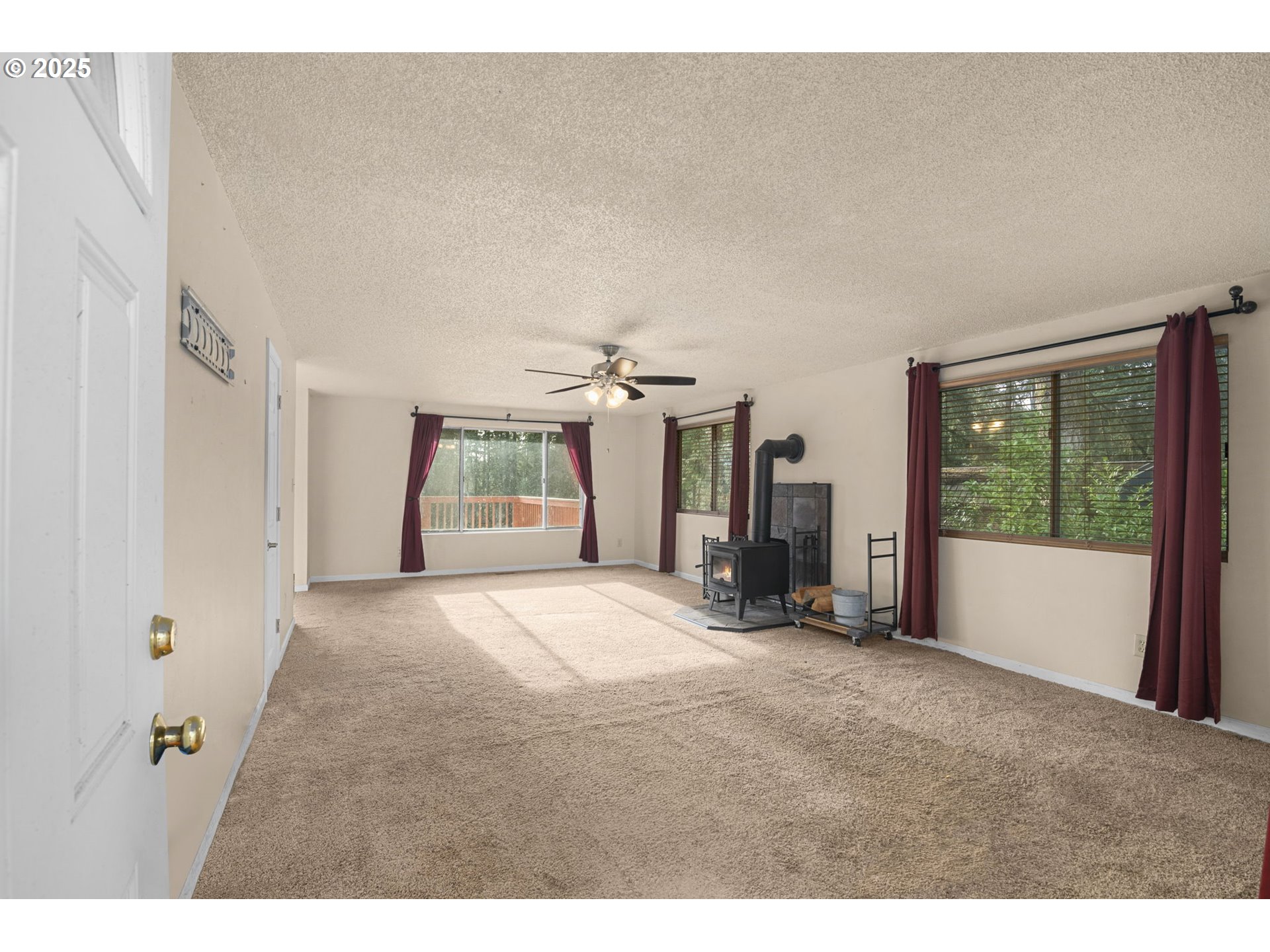 32198 Cater Road Warren, OR 97053 - Photo 32 of 48 a view of a big room with windows and chandelier