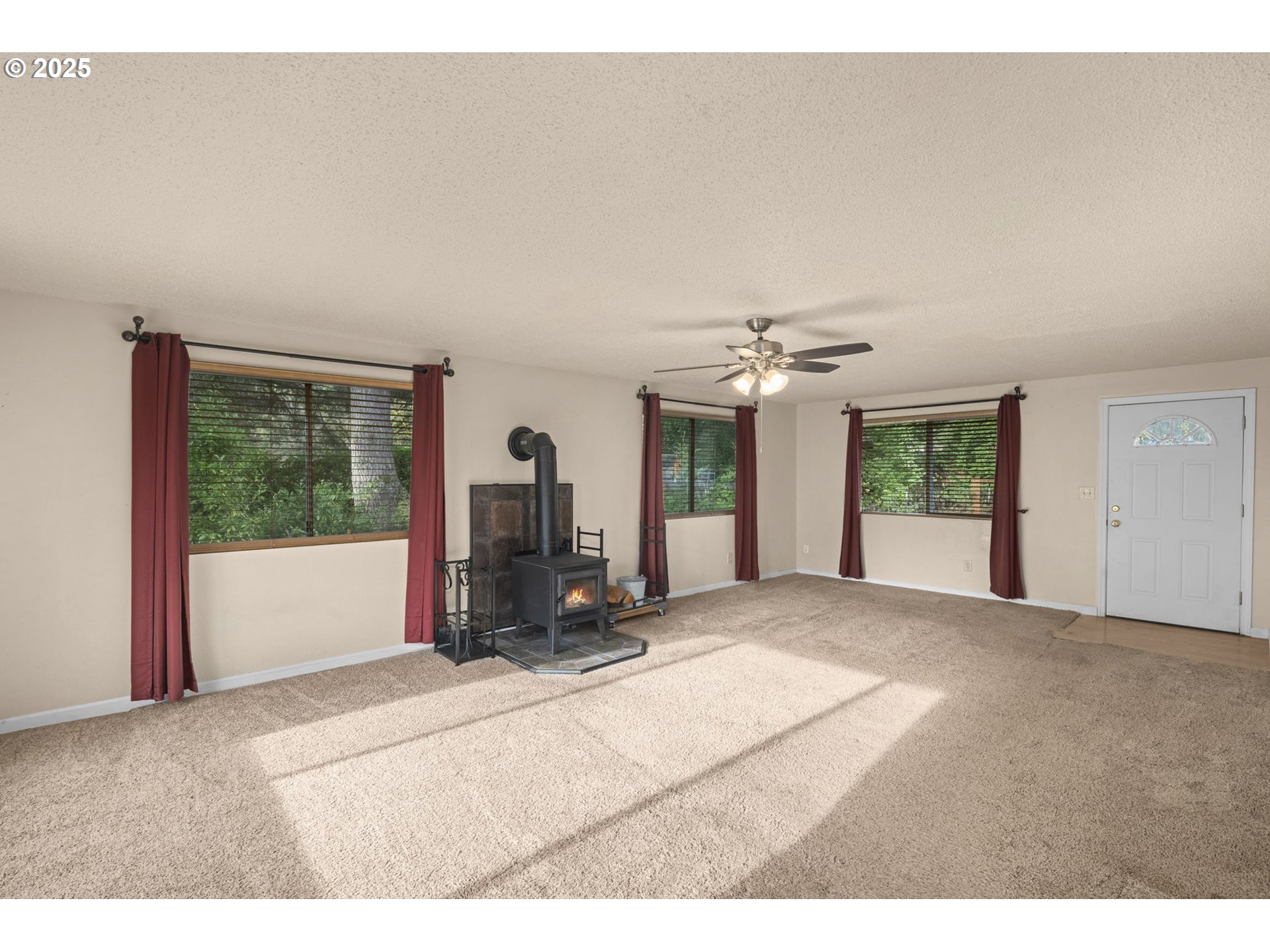 32198 Cater Road Warren, OR 97053 - Photo 34 of 48 a view of a livingroom with a ceiling fan and window