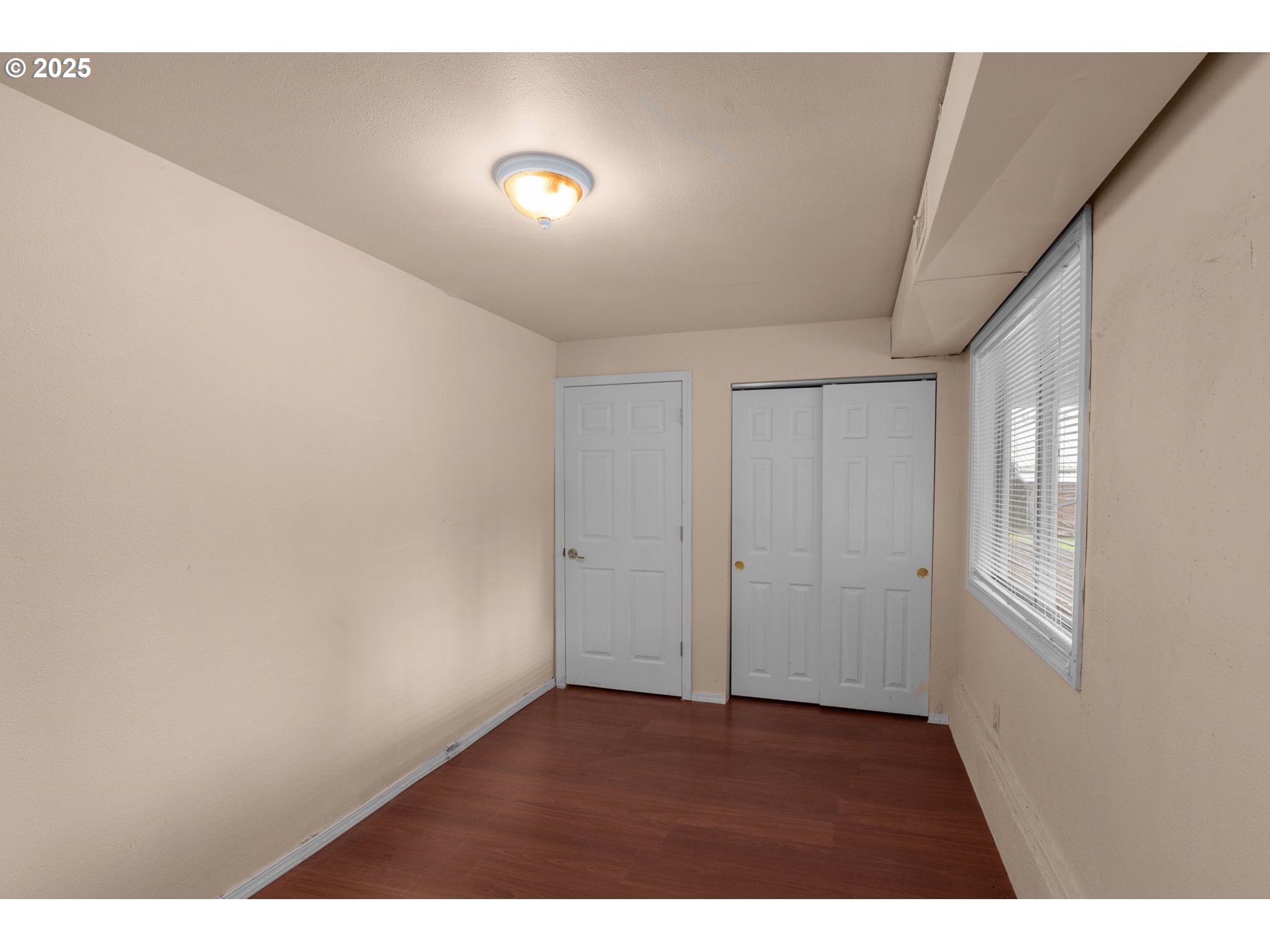 32198 Cater Road Warren, OR 97053 - Photo 43 of 48 a view of an empty room with wooden floor and a window