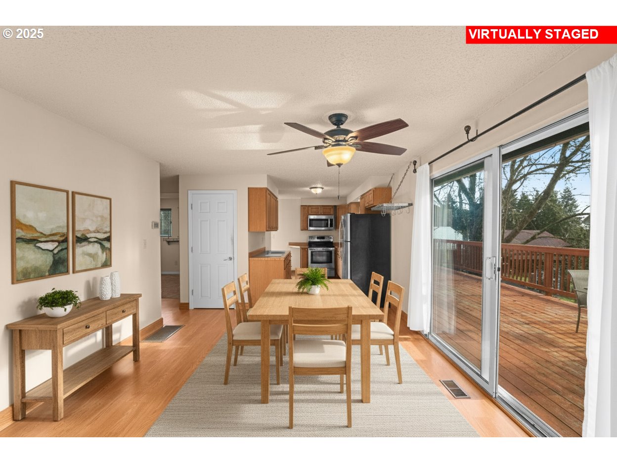 32198 Cater Road Warren, OR 97053 - Photo 5 of 48 a dining room with wooden floor and large window