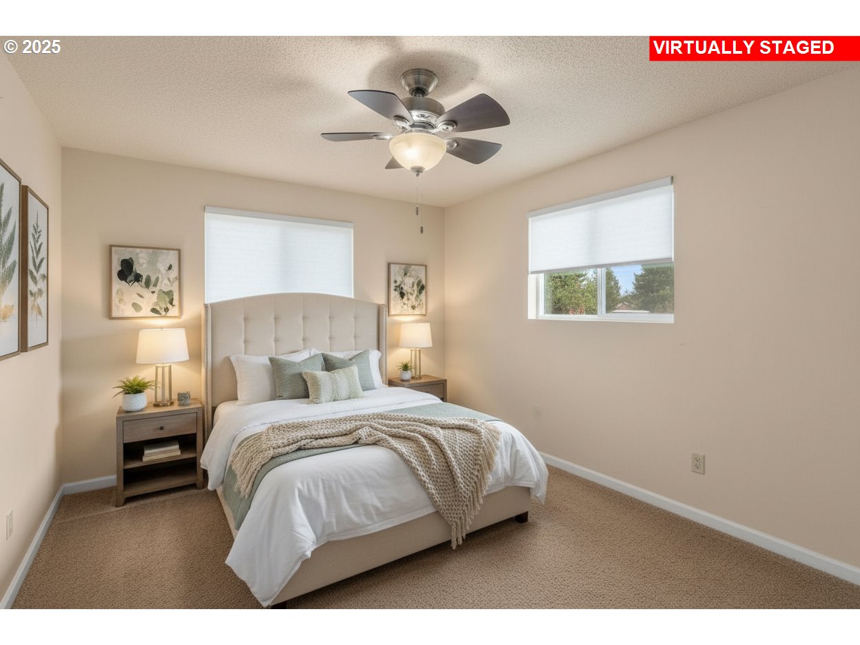 32198 Cater Road Warren, OR 97053 - Photo 6 of 48 a bedroom with a bed and a chandelier