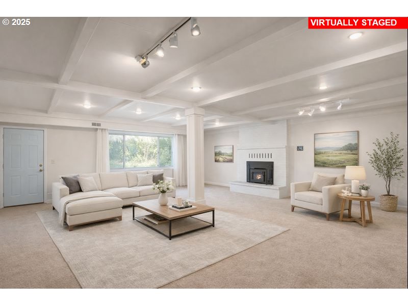 32198 Cater Road Warren, OR 97053 - Photo 10 of 48 a living room with furniture and a fireplace