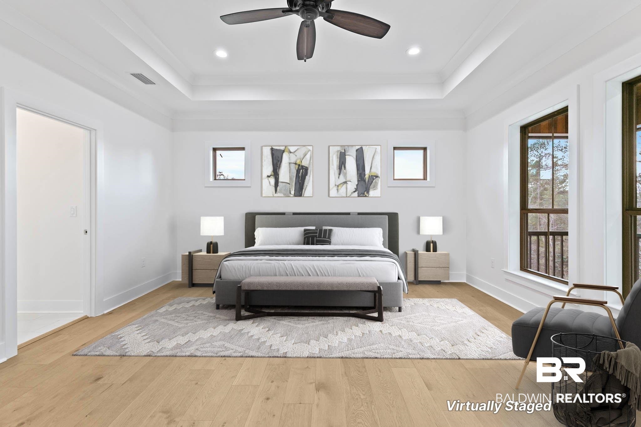6656 Garrison Drive Daphne, AL 36527 - Photo 25 of 57 Bedroom featuring light wood-type flooring, a ceiling fan, a raised ceiling, recessed lighting, and crown molding