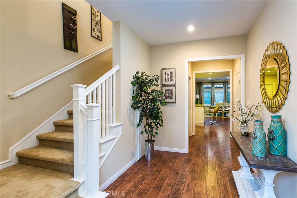 75 Gardenstone Path Irvine, CA 92620 - Photo 13 of 65 a view of entryway and hall with wooden floor