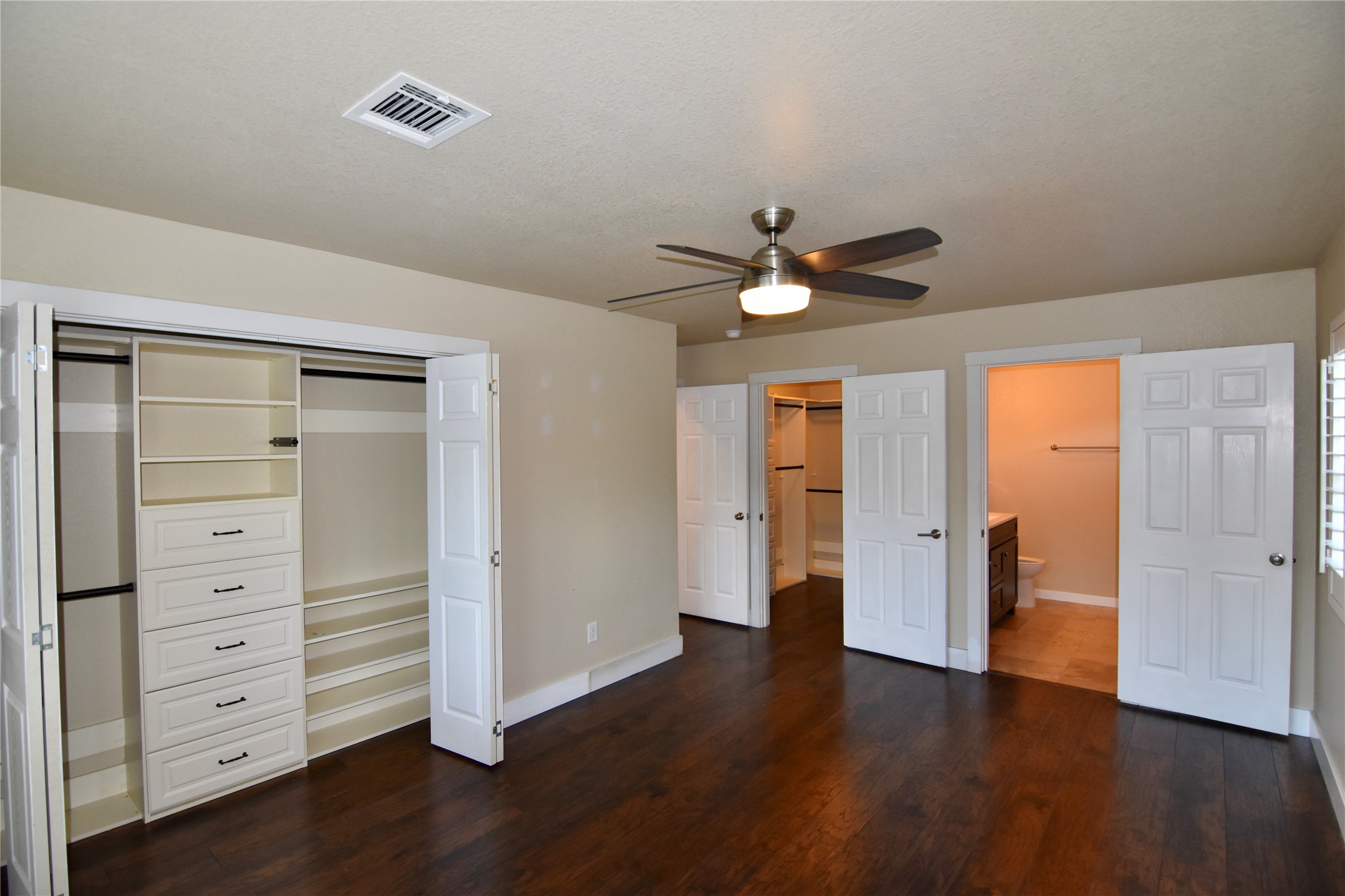 112 Ridge Harbor Drive Spicewood, TX 78669 - Photo 16 of 40 a view of an empty room with a window and wooden floor