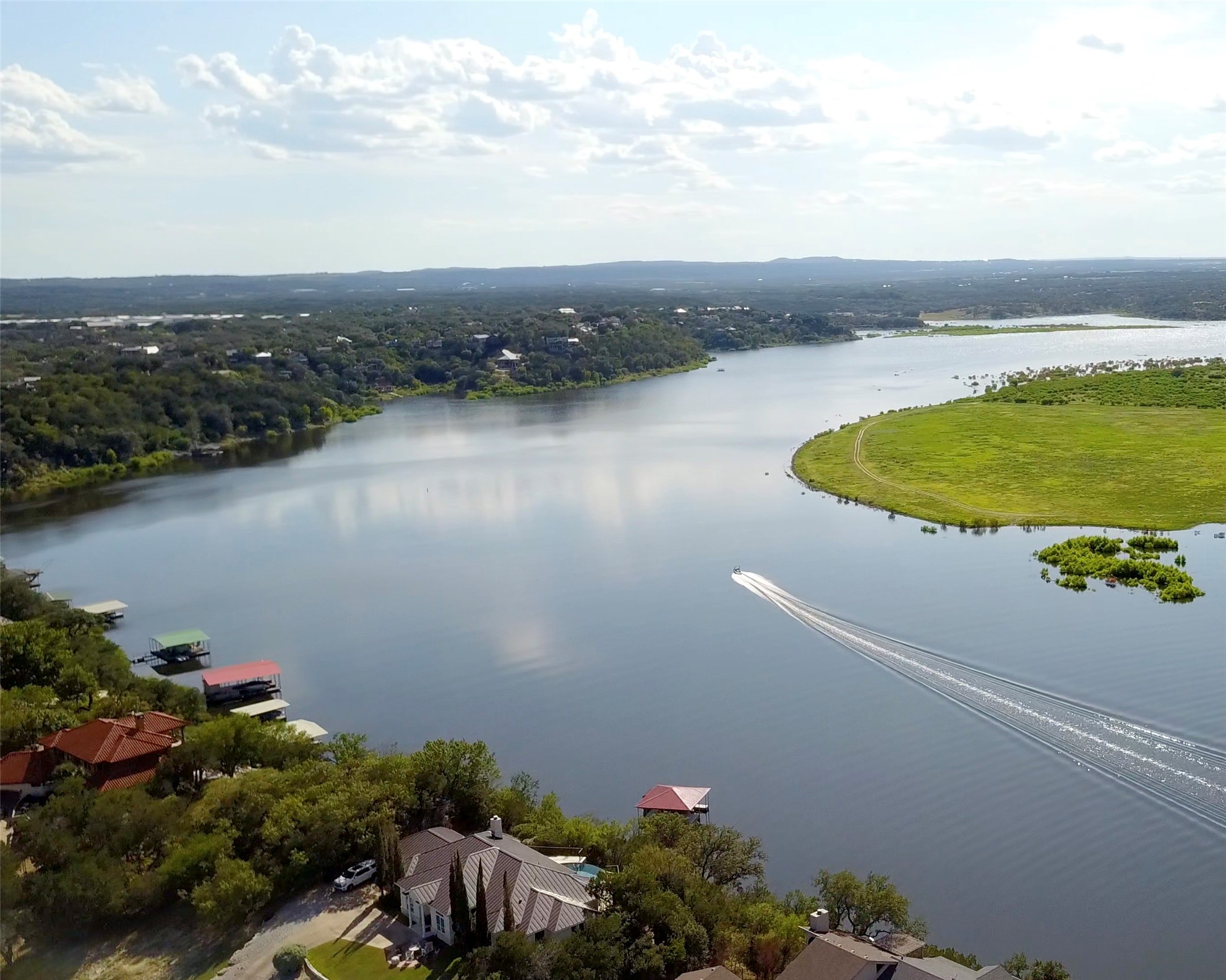 112 Ridge Harbor Drive Spicewood, TX 78669 - Photo 29 of 40 a view of a lake with a house