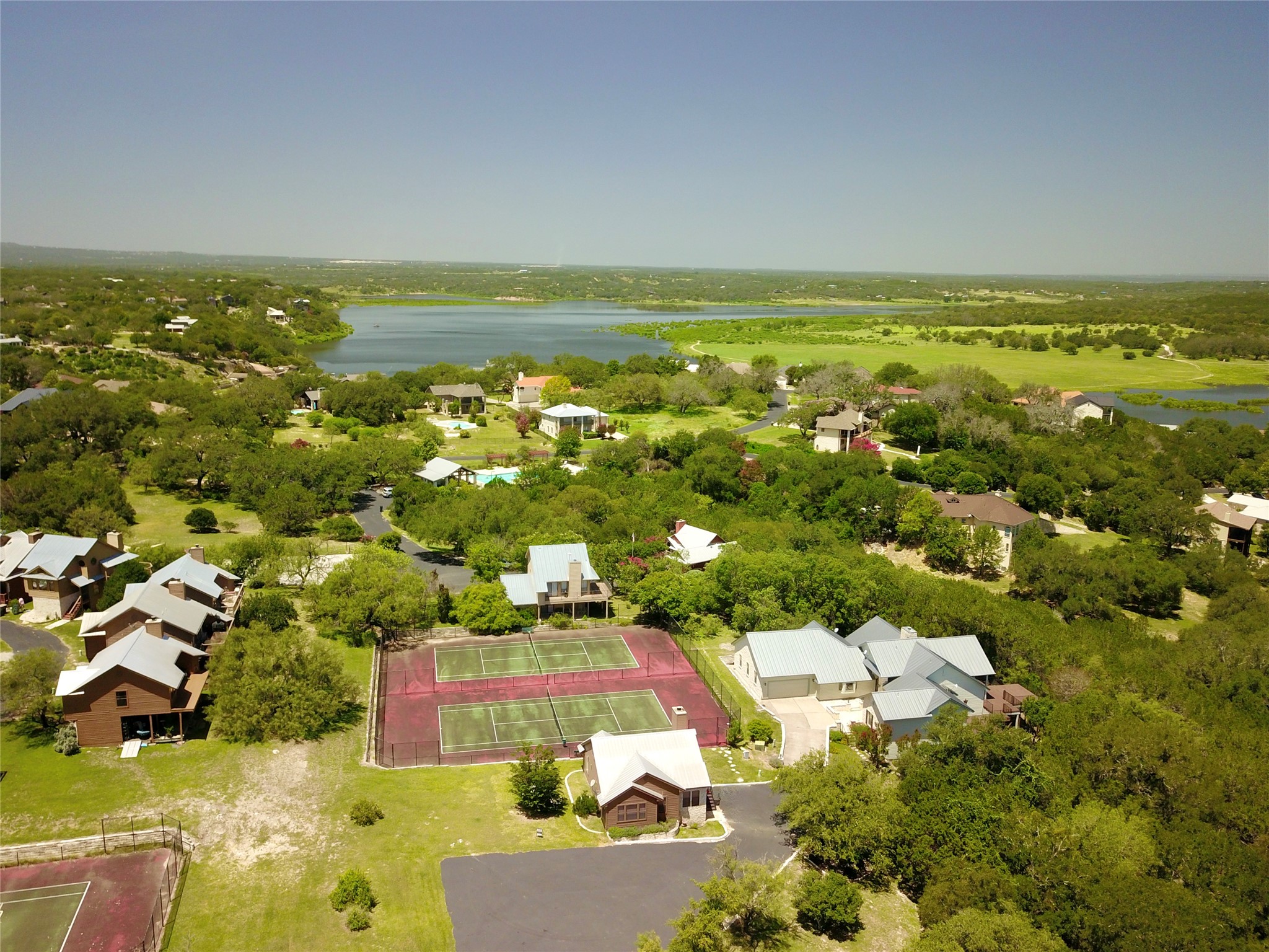 112 Ridge Harbor Drive Spicewood, TX 78669 - Photo 31 of 40 an aerial view of residential houses with outdoor space