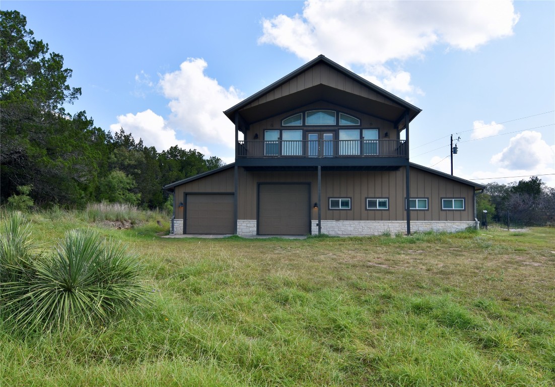 112 Ridge Harbor Drive Spicewood, TX 78669 - Photo 36 of 40 a view of a house with a yard