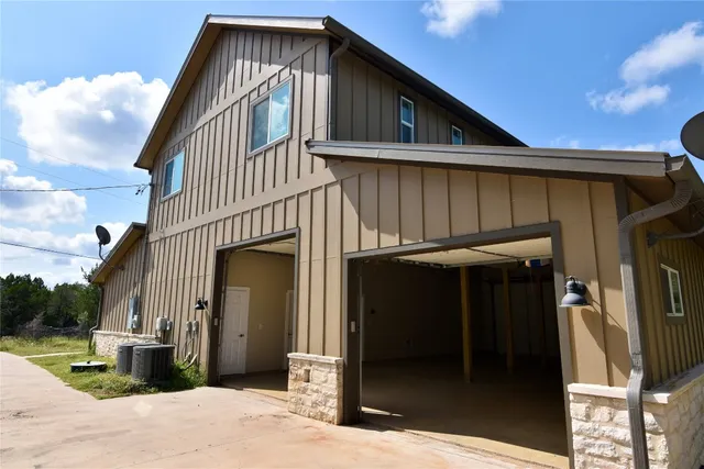 a front view of a house with a garage