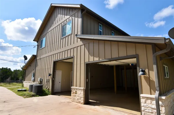 a front view of a house with a garage
