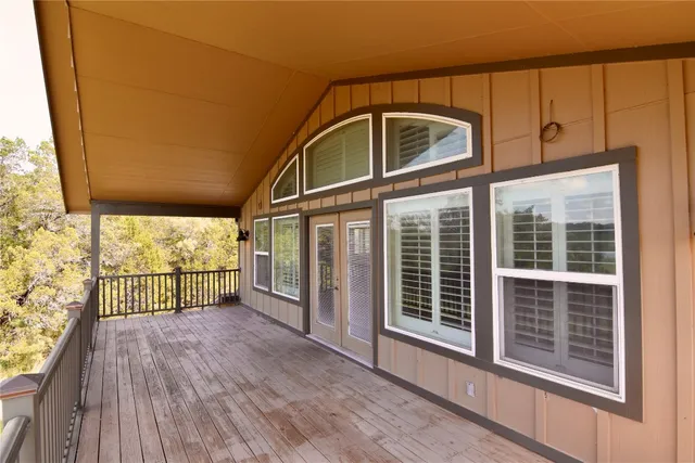 a view of a glass door with wooden floor