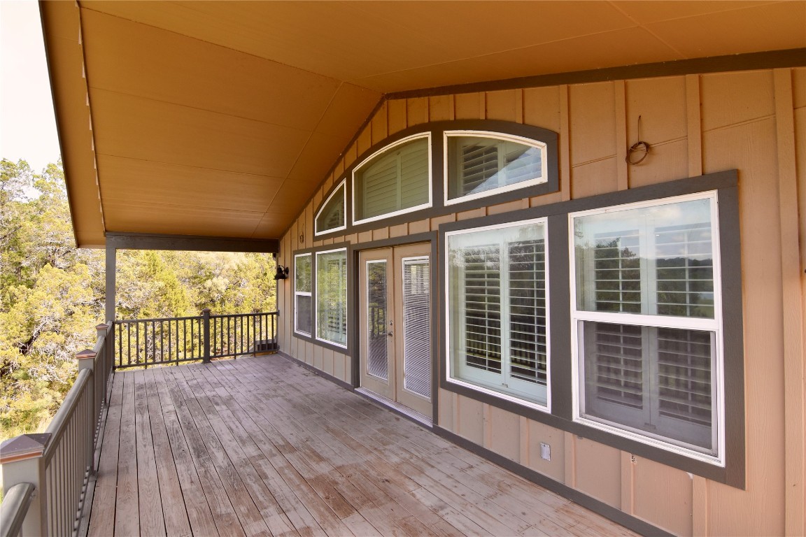 112 Ridge Harbor Drive Spicewood, TX 78669 - Photo 10 of 40 a view of a glass door with wooden floor