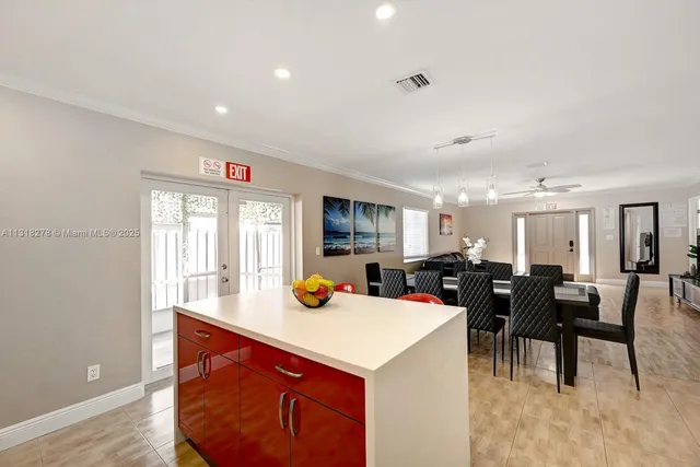 a view of a dining room with furniture and chandelier