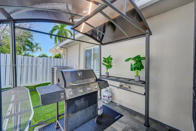 a patio with table and chairs