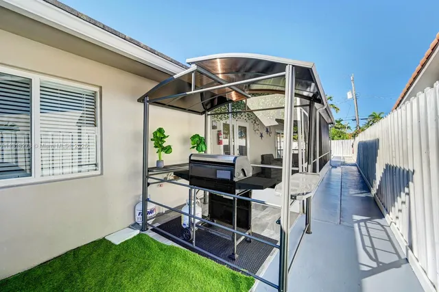 a patio with table and chairs