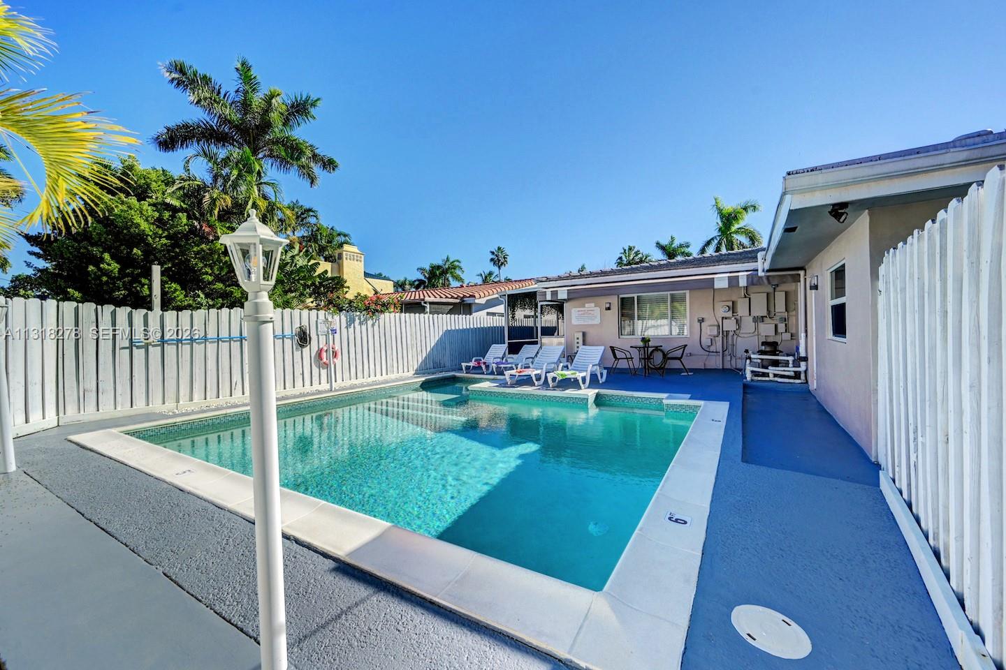 825 Harrison Street Hollywood, FL 33019 - Photo 31 of 37 a view of a porch and garden