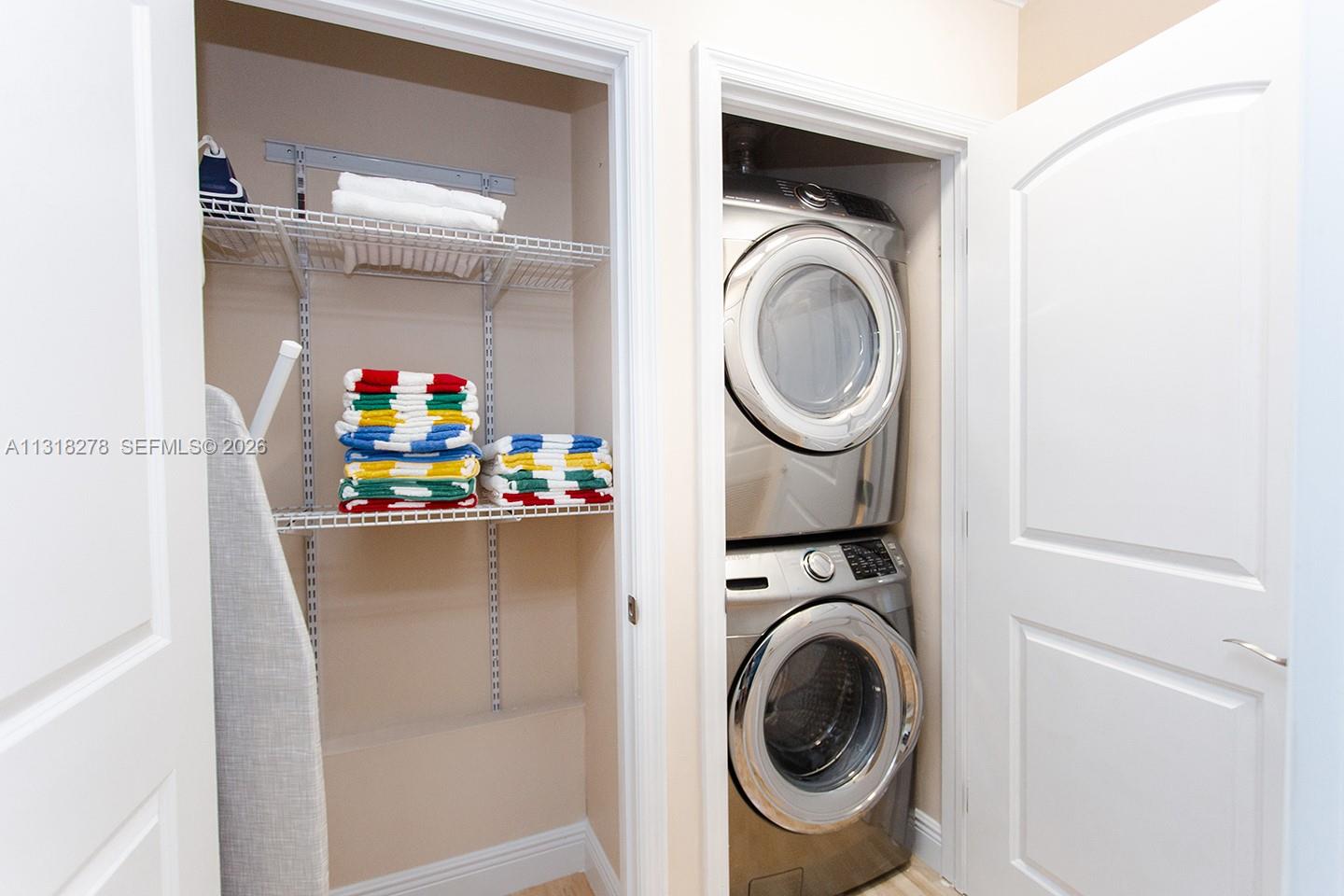 825 Harrison Street Hollywood, FL 33019 - Photo 5 of 37 a utility room with dryer and washer