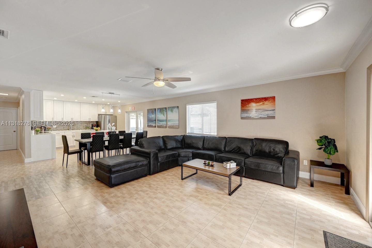 825 Harrison Street Hollywood, FL 33019 - Photo 6 of 37 a living room with furniture and kitchen view