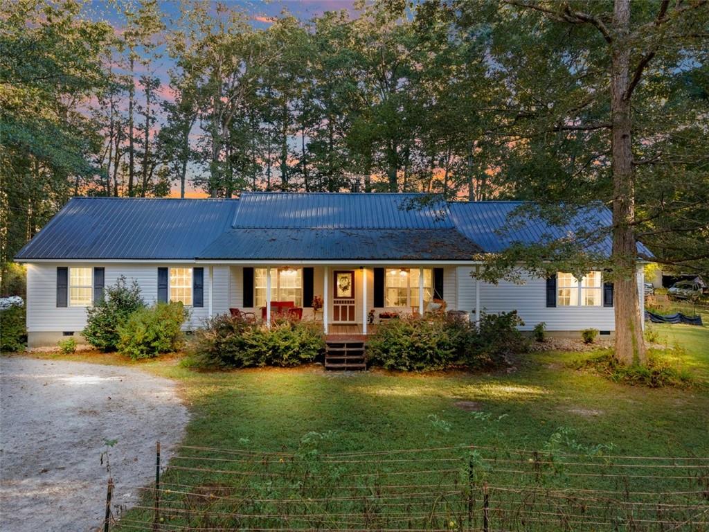 1955 Rockmart Road Villa Rica, GA 30180 - Photo 1 of 1 a view of a house with garden and a tree