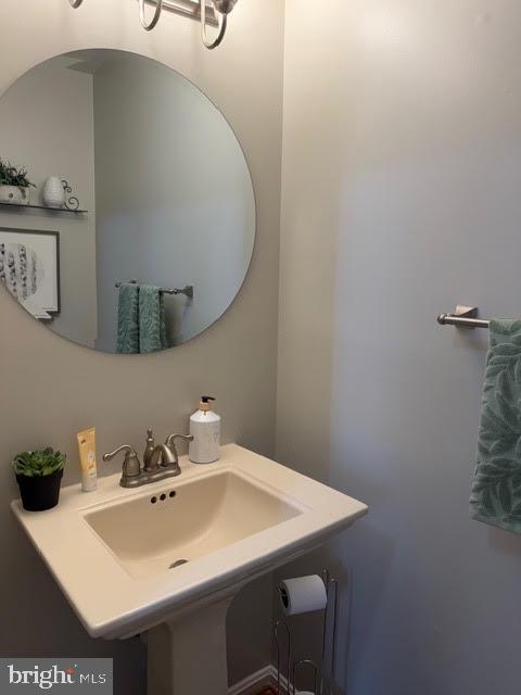 5534 Rockfish Way Clinton, MD 20735 - Photo 11 of 46 a bathroom with a sink and a mirror