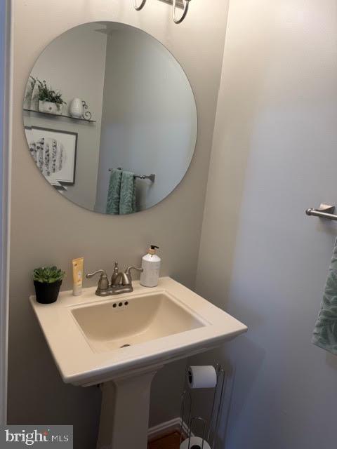 5534 Rockfish Way Clinton, MD 20735 - Photo 12 of 46 a bathroom with a sink and a mirror