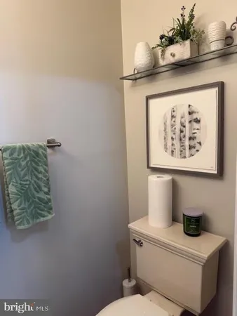 a bathroom with a toilet and a sink