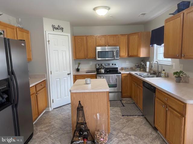 5534 Rockfish Way Clinton, MD 20735 - Photo 15 of 46 a kitchen with stainless steel appliances a stove refrigerator sink and microwave