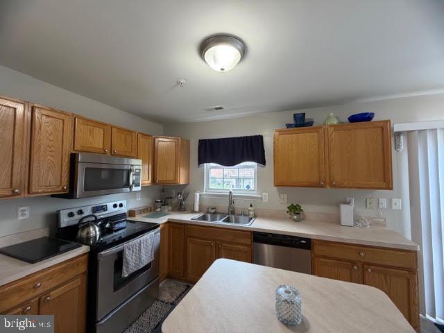 5534 Rockfish Way Clinton, MD 20735 - Photo 18 of 46 a kitchen with granite countertop a sink cabinets and stainless steel appliances